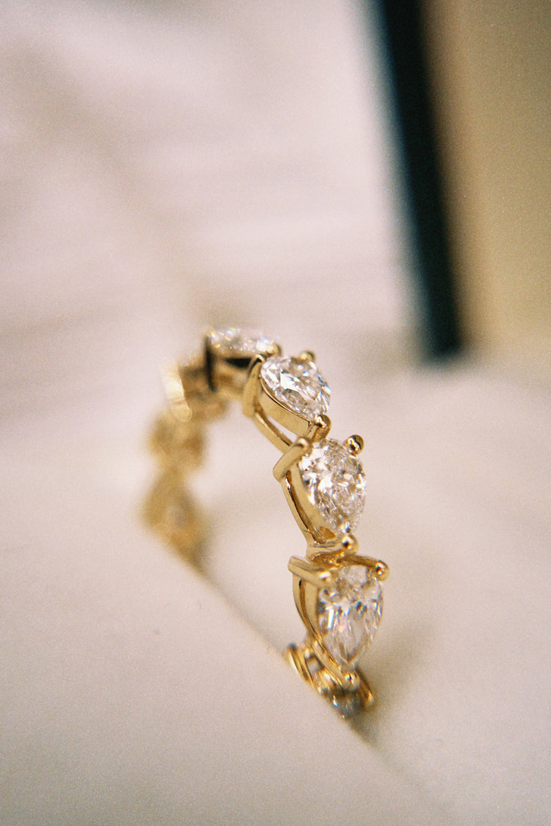 East-West Pear Shared Prong Eternity Band